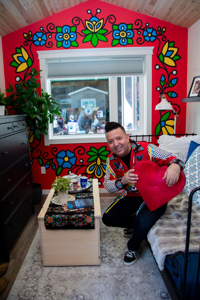 Lance Cardinal in home image on Honouring a Legacy: Trade Winds to Success Unveils Eco-Smart Small Home with Cree Artist Lance Cardinal