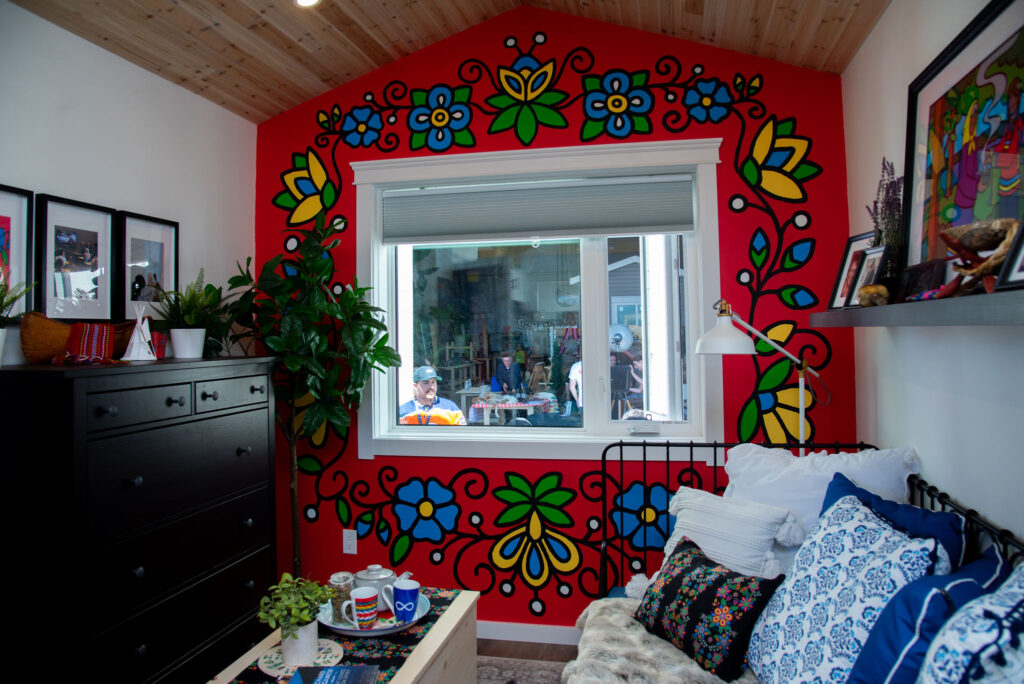 painted wall image on Honouring a Legacy: Trade Winds to Success Unveils Eco-Smart Small Home with Cree Artist Lance Cardinal